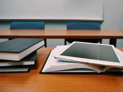 Classroom with books, tablets on tables