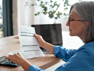 Woman analyzing paperwork